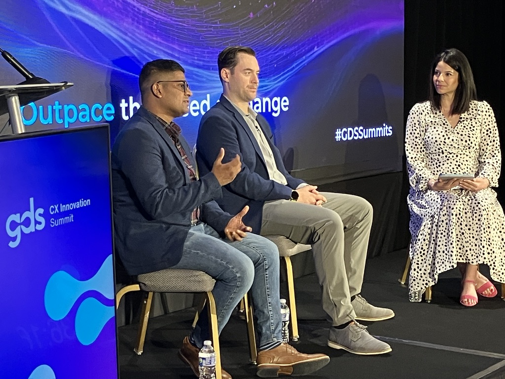 Manu sharing a point during a CX Innovation Summit panel