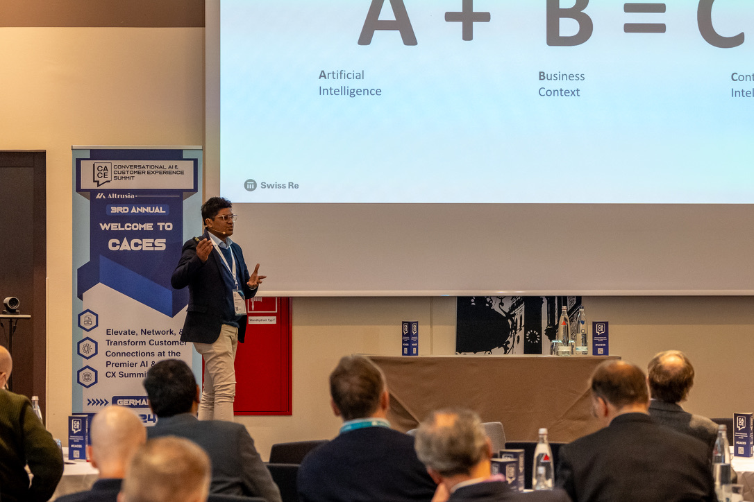 Manu presenting an AI and business context framework to an audience